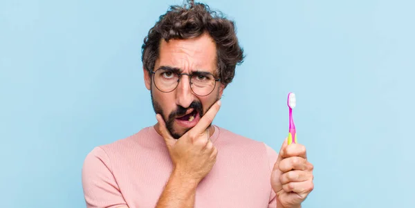 Young Bearded Man Mouth Eyes Wide Open Hand Chin Feeling — Stock Photo, Image