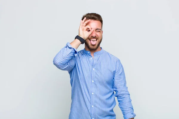 Young Man Smiling Happily Funny Face Joking Looking Peephole Spying — Stock Photo, Image