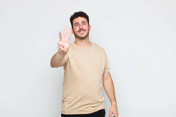 Young Man Smiling Looking Friendly Showing Number Three Third Hand — Stock Photo, Image