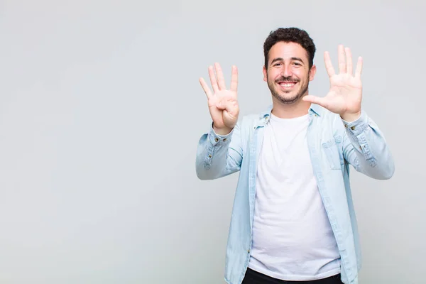 Young Man Smiling Looking Friendly Showing Number Nine Ninth Hand — Stock Photo, Image