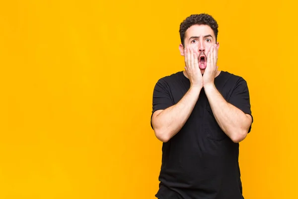 Young Man Feeling Shocked Scared Looking Terrified Open Mouth Hands — Stock Photo, Image