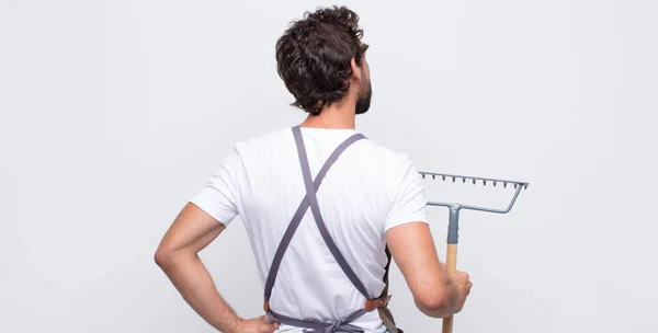 Young Man Feeling Confused Full Doubts Questions Wondering Hands Hips — Stock Photo, Image