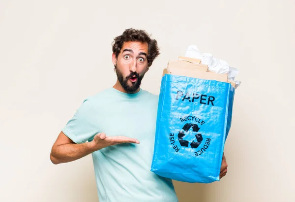 Young Man Looking Surprised Shocked Jaw Dropped Holding Object Open — Stock Photo, Image