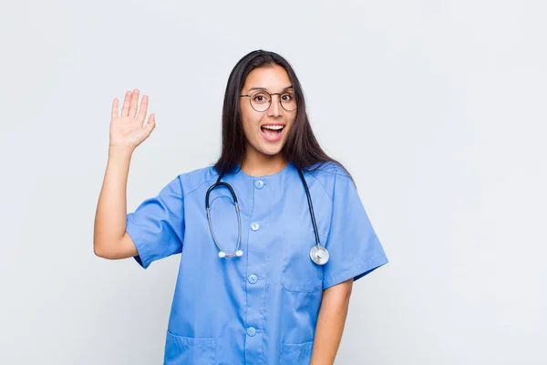 Pretty Woman Smiling Happily Cheerfully Waving Hand Welcoming Greeting You — Stock Photo, Image