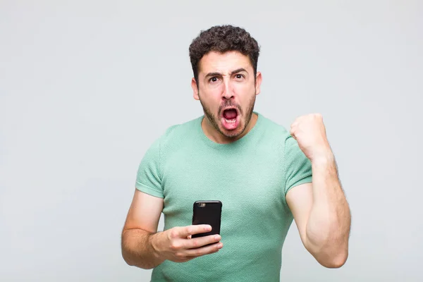 Young Man Shouting Aggressively Angry Expression Fists Clenched Celebrating Success — Stock Photo, Image