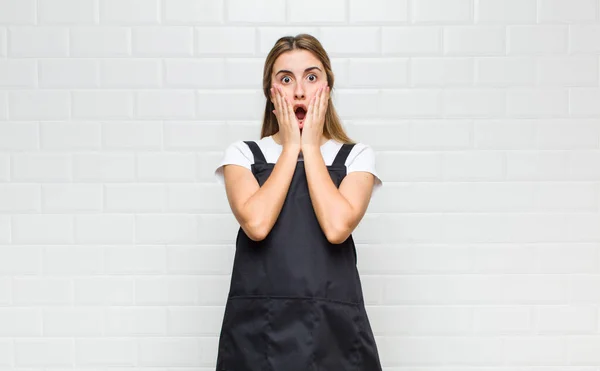 Blonde Woman Feeling Shocked Scared Looking Terrified Open Mouth Hands — Stock Photo, Image