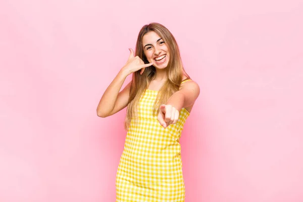 Blonde Woman Smiling Cheerfully Pointing Camera While Making Call You — Stock Photo, Image