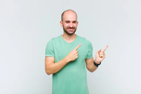 Bald Man Smiling Happily Pointing Side Upwards Both Hands Showing — Stock Photo, Image