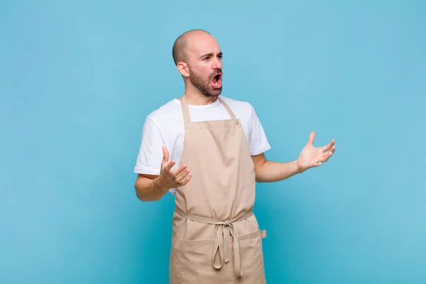 bald man performing opera or singing at a concert or show, feeling romantic, artistic and passionate