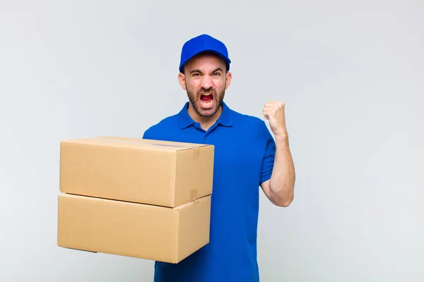 Young Bald Man Shouting Aggressively Angry Expression Fists Clenched Celebrating — Stock Photo, Image