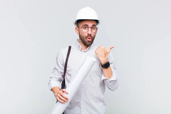 Young Bald Man Looking Astonished Disbelief Pointing Object Side Saying — Stock Photo, Image