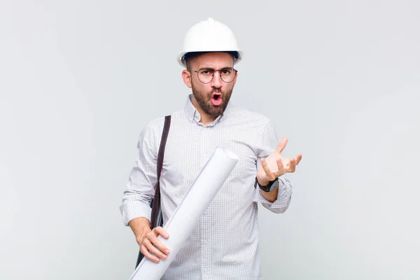 Young Bald Man Feeling Extremely Shocked Surprised Anxious Panicking Stressed — Stock Photo, Image