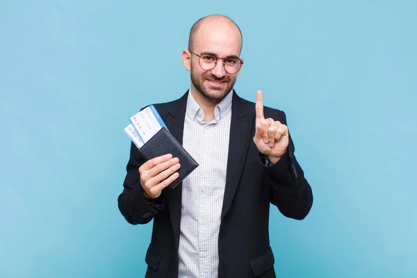 Young Bald Man Smiling Looking Friendly Showing Number One First — Stock Photo, Image