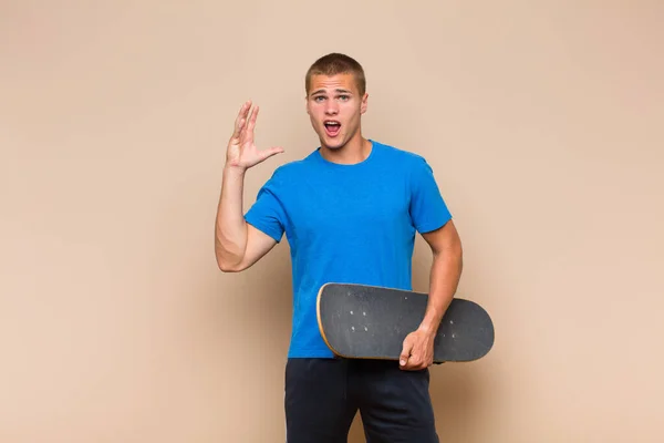 Young Blonde Man Screaming Hands Air Feeling Furious Frustrated Stressed — Stock Photo, Image