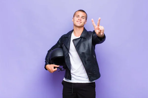 Young Blonde Man Smiling Looking Happy Carefree Positive Gesturing Victory — Stock Photo, Image