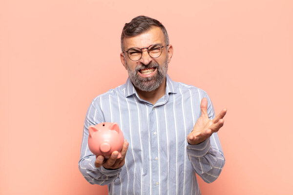 adult handsome man looking angry, annoyed and frustrated screaming wtf or whats wrong with you  