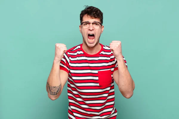 Young Man Shouting Aggressively Angry Expression Fists Clenched Celebrating Success — Stock Photo, Image