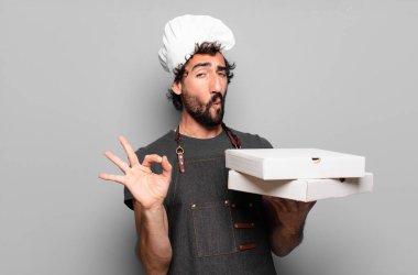 Genç sakallı adam. Pizza şefi konsepti