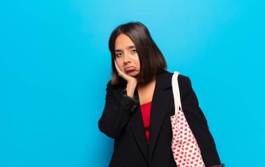 young pretty woman with a hearts bag