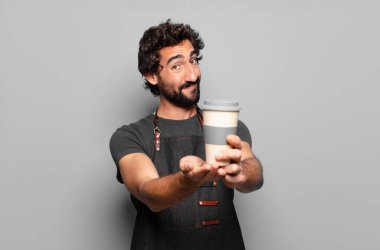 Genç sakallı bir adam ve paket servis konsepti.