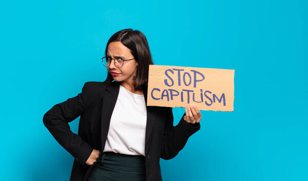 young pretty woman with 'Stop capitlism' text