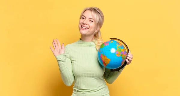 Blonde Woman Smiling Happily Cheerfully Waving Hand Welcoming Greeting You — Stock Photo, Image