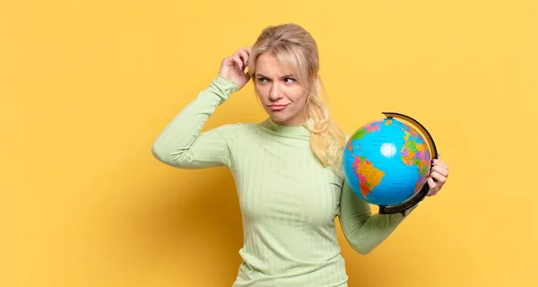 Blonde Woman Feeling Puzzled Confused Scratching Head Looking Side Royalty Free Stock Images