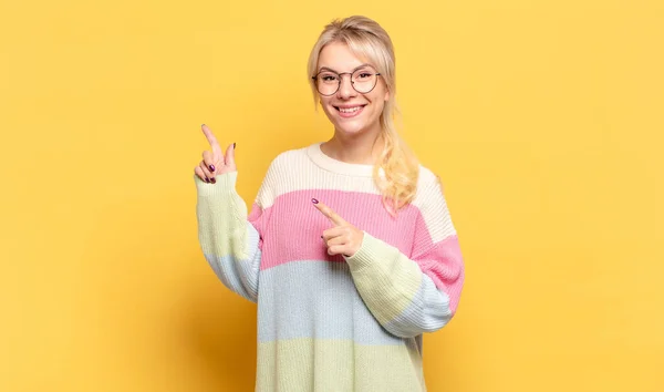 Blonde Woman Smiling Happily Pointing Side Upwards Both Hands Showing — Stock Photo, Image