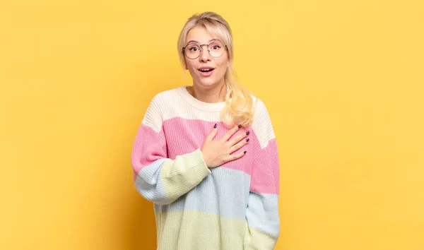 Blonde Woman Feeling Shocked Surprised Smiling Taking Hand Heart Happy — Stock Photo, Image