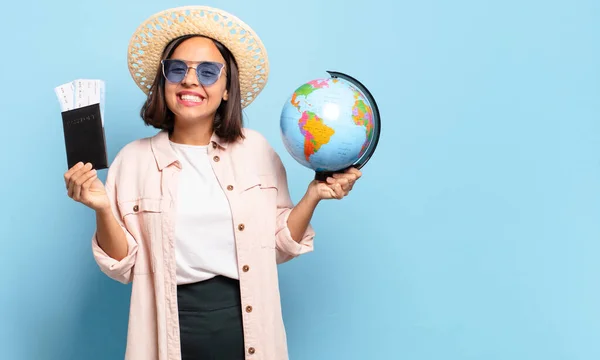 young pretty traveler woman with a world globe map. travel or holidays concept