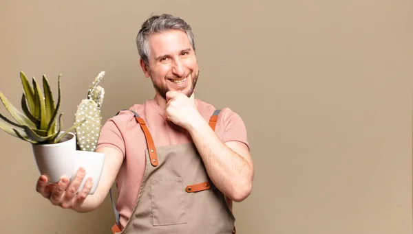 middle age gardener man with cactus