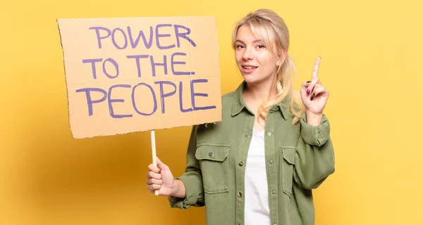 blonde pretty activist woman. power to the people concept