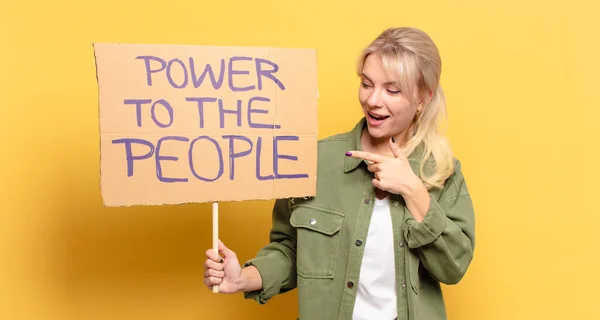 blonde pretty activist woman. power to the people concept