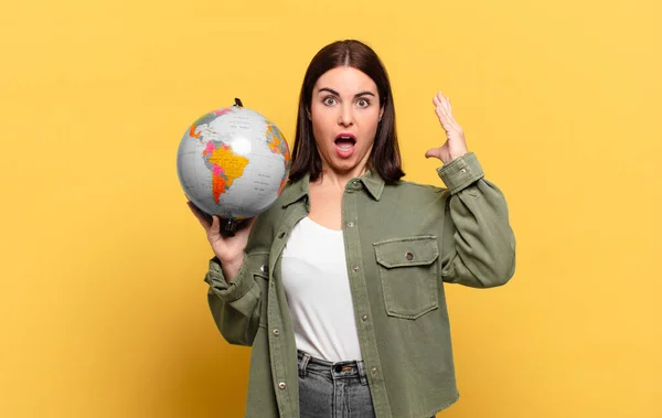 stock image young pretty woman screaming with hands up in the air, feeling furious, frustrated, stressed and upset