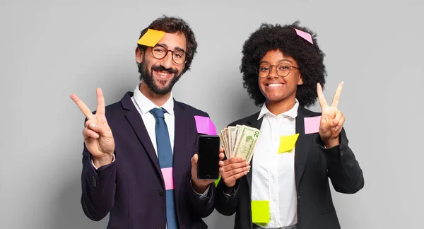 Young Businesspeople Smiling Looking Happy Carefree Positive Gesturing Victory Peace — Stock Photo, Image