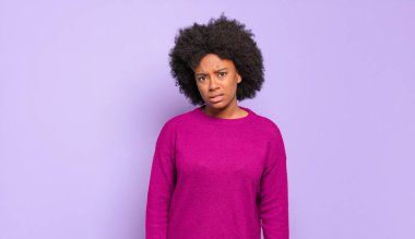  feeling puzzled and confused, with a dumb, stunned expression looking at something unexpected