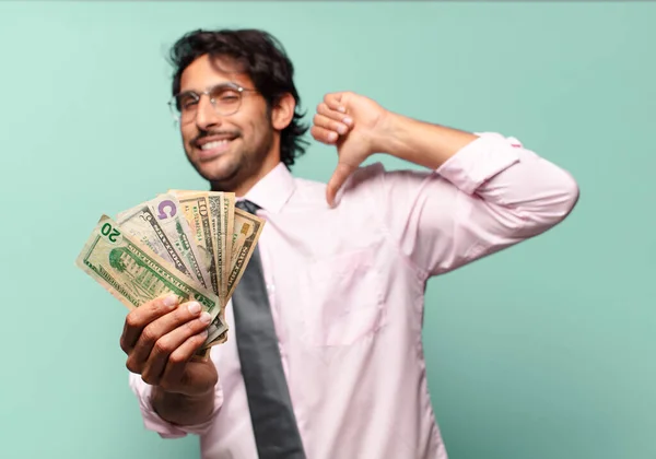 adult handsome indian businessman with dollar banknotes