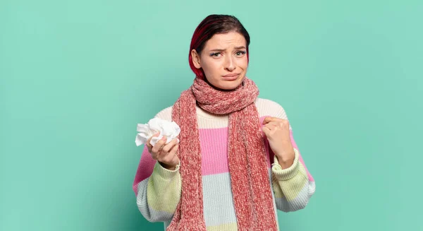 stock image young attractive red hair woman looking arrogant, successful, positive and proud, pointing to self flu concept