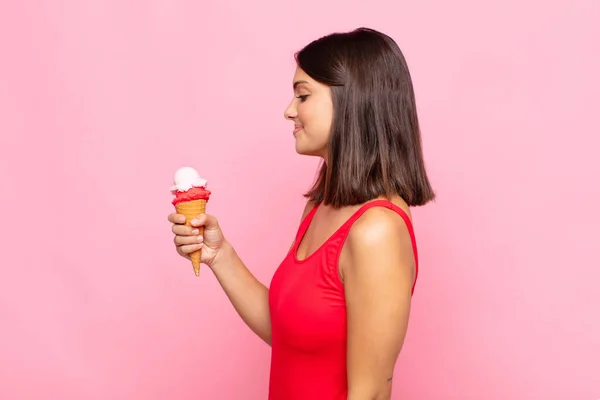 young pretty woman with an ice cream cone. summer concept