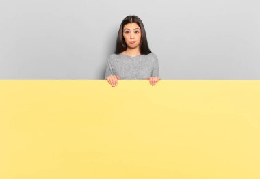 young pretty woman feeling sad and whiney with an unhappy look, crying with a negative and frustrated attitude. copy space to place your concept