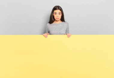 young pretty woman feeling sad and stressed, upset because of a bad surprise, with a negative, anxious look. copy space to place your concept