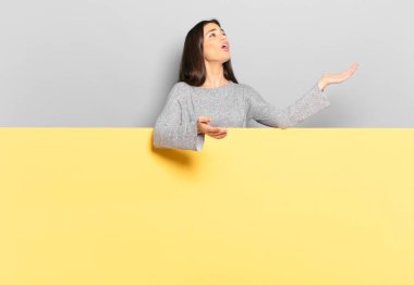 young pretty woman performing opera or singing at a concert or show, feeling romantic, artistic and passionate. copy space to place your concept