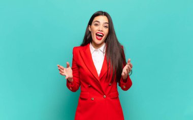 young pretty woman feeling happy, astonished, lucky and surprised, like saying omg seriously? Unbelievable. business concept