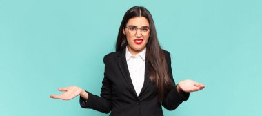 young pretty woman feeling clueless and confused, not sure which choice or option to pick, wondering. business concept