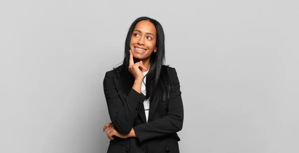 Young Black Woman Smiling Happily Daydreaming Doubting Looking Side Business — ストック写真