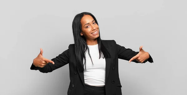 Young Black Woman Looking Proud Arrogant Happy Surprised Satisfied Pointing — Stockfoto