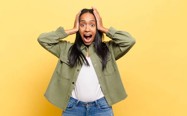Young Black Woman Raising Hands Head Open Mouthed Feeling Extremely — Stockfoto