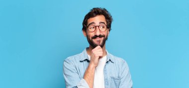 Genç, deli, sakallı adam. Düşünen ya da kuşkulu ifade