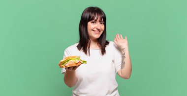 Mutlu ve mutlu bir şekilde gülümseyen, el sallayan, seni selamlayan, ya da hoşça kal diyen