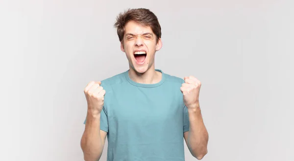 Young Boy Shouting Aggressively Angry Expression Fists Clenched Celebrating Success — Stock Photo, Image